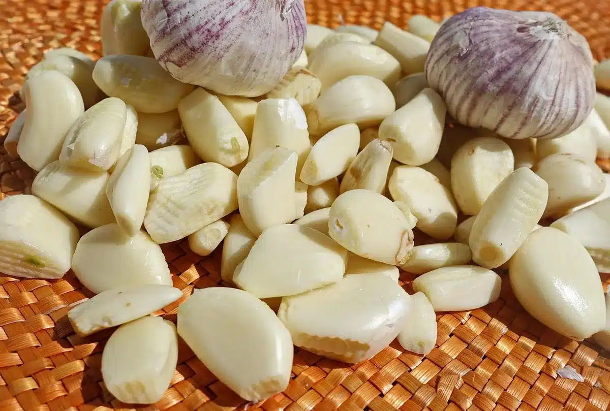 Caramelizing onions and garlic in a skillet until soft and golden