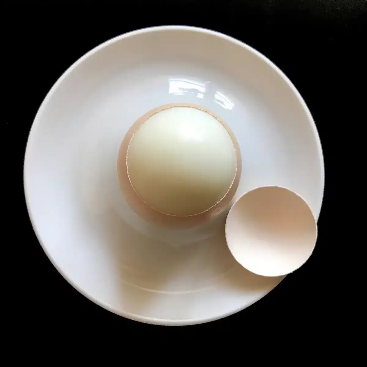 Bowl with chopped hard-boiled eggs and mayonnaise ready to mix