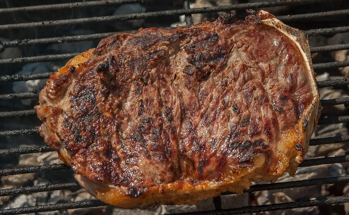 Gas grill set up with indirect heat and ribs over the cool zone