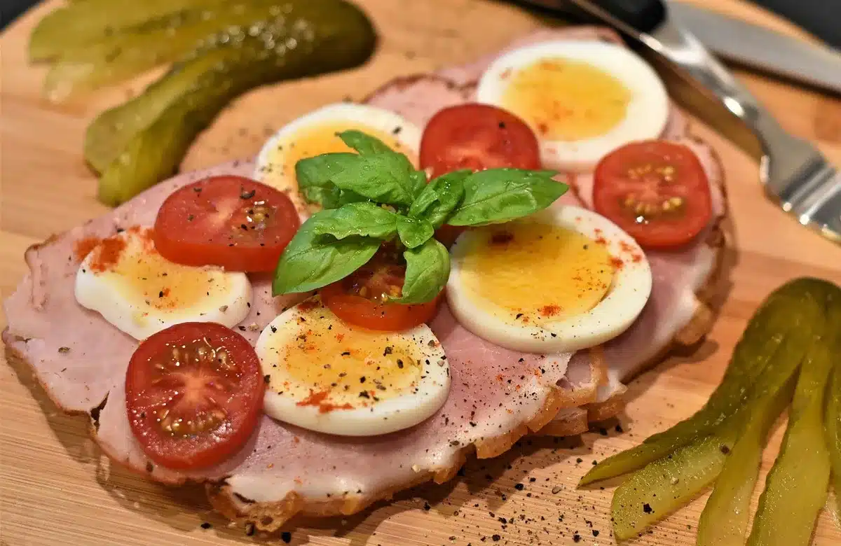 Ingredients laid out: bread, sliced ham, turkey and Swiss cheese